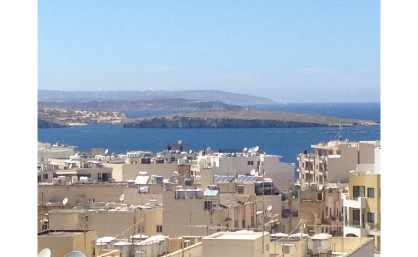 Real estate Malta Qawra 1 bedroom penthouse with distant seaviews